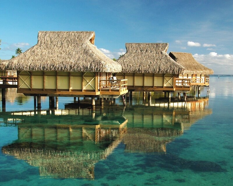 Thatched Bungalows on Water — Blue, Serene, Afternoon