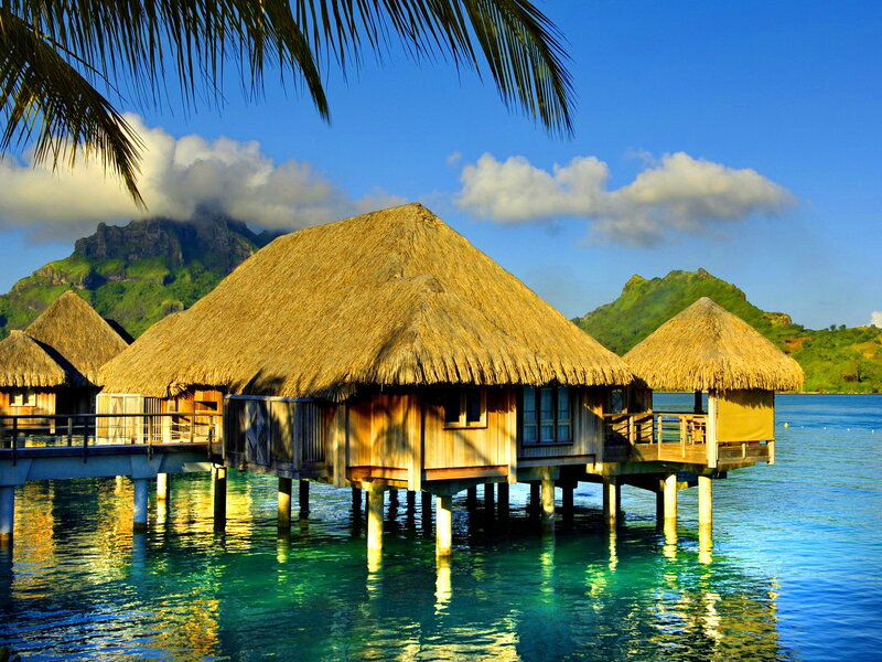 Thatched Bungalows on Water — Blue, Serene, Morning