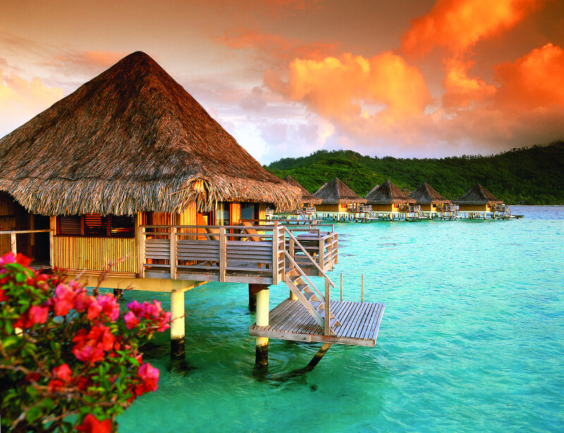 Thatched Bungalows on Water — Orange
