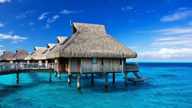 Thatched Bungalows over Water — Blue, Serene