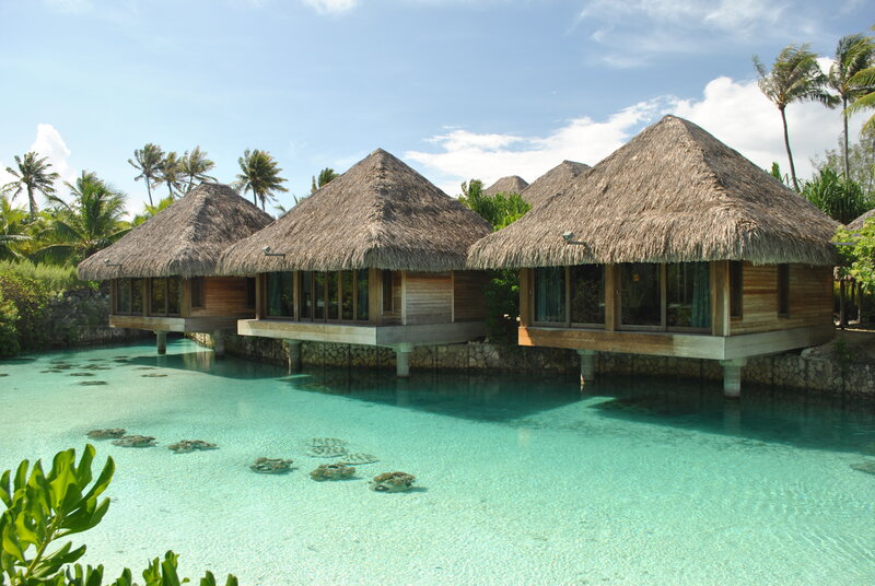 Thatched Bungalows over Water — Blue