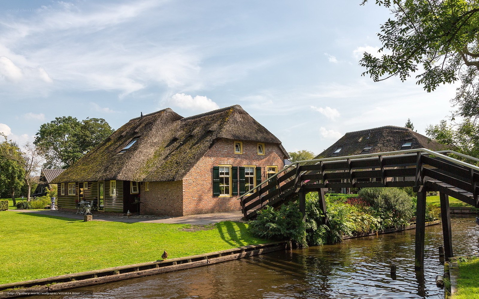 Thatched cottage by a canal