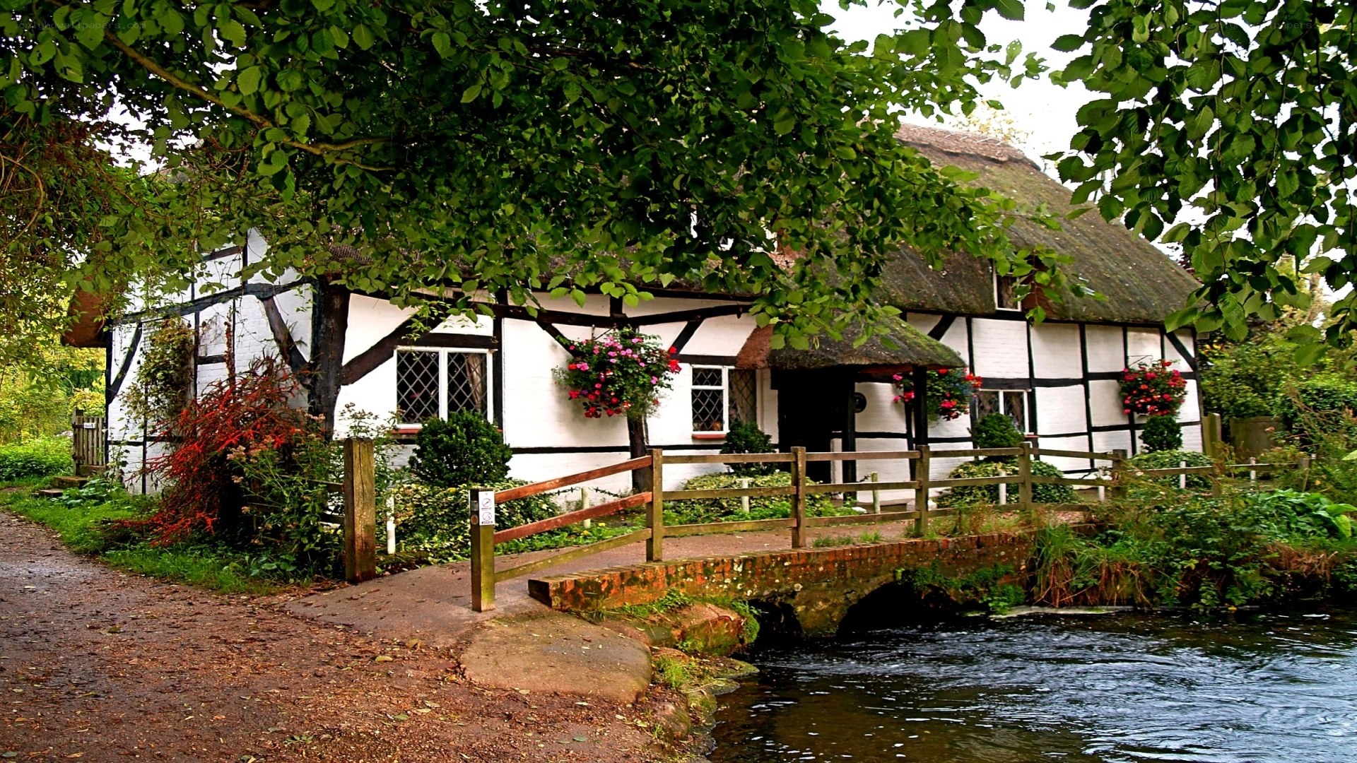 Thatched cottage by a river