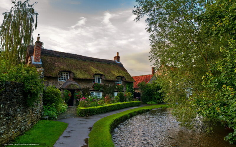 Thatched cottage by a river