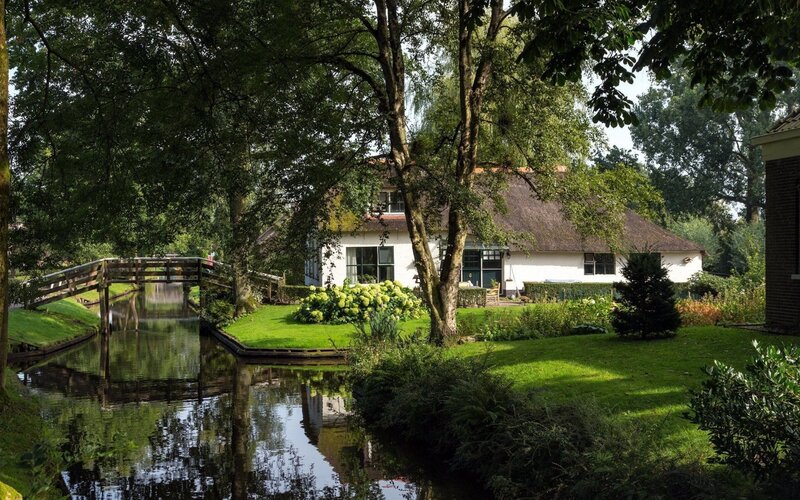 Thatched Cottage by Canal — Green, Serene, Afternoon, Photograph, Bridge