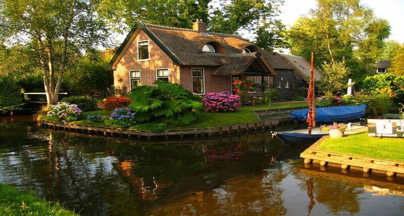 Thatched Cottage by Canal — Green, Serene, Afternoon, Photograph