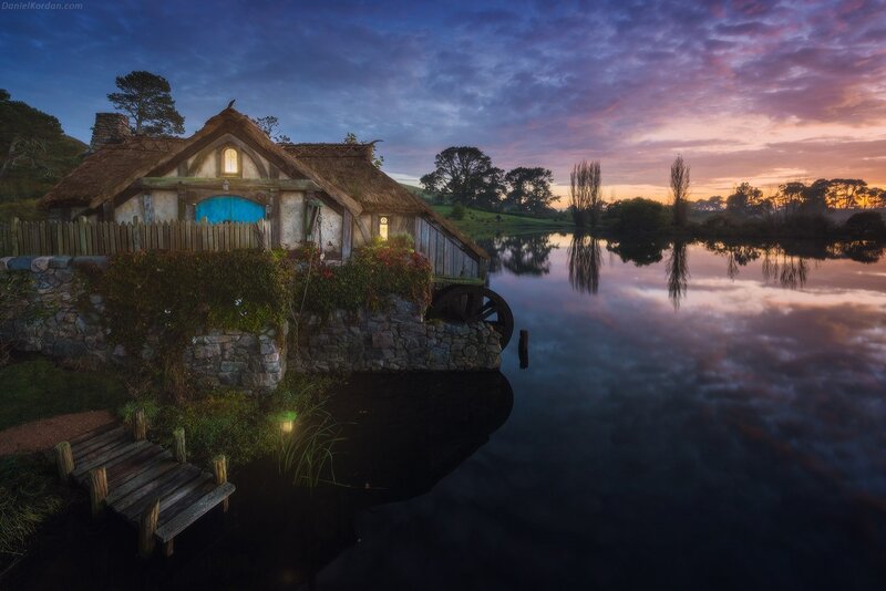 Thatched Cottage by Lake — Blue, Serene, Sunset