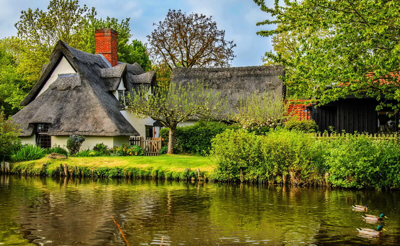 Thatched Cottage by River — Green, Serene, Spring