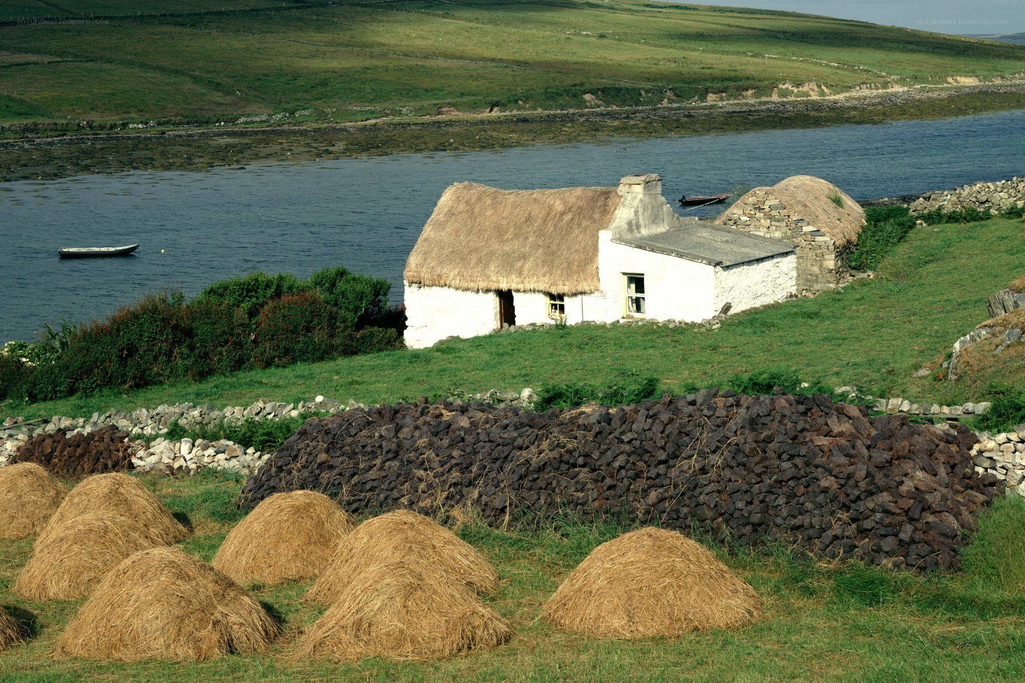 Thatched cottage by the water