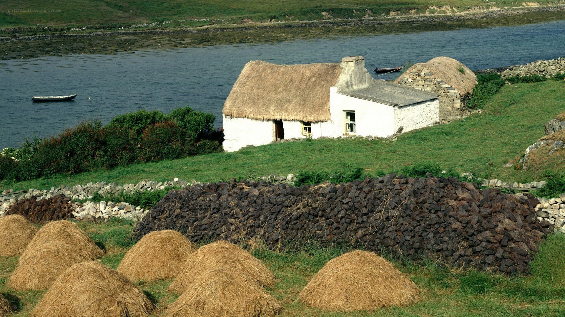 Thatched cottage by the water