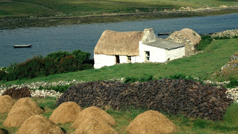 Thatched cottage by the water