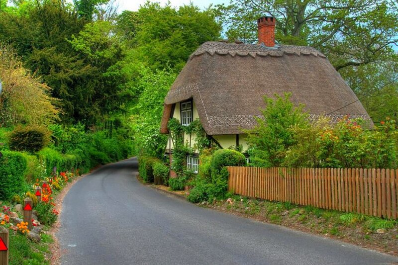 Thatched cottage on a country road