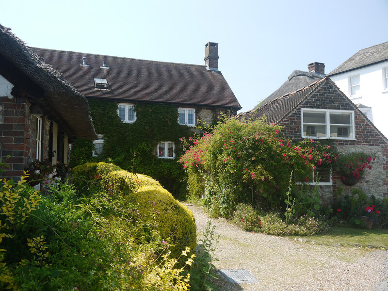 Thatched Cottages in Garden — Green, Serene