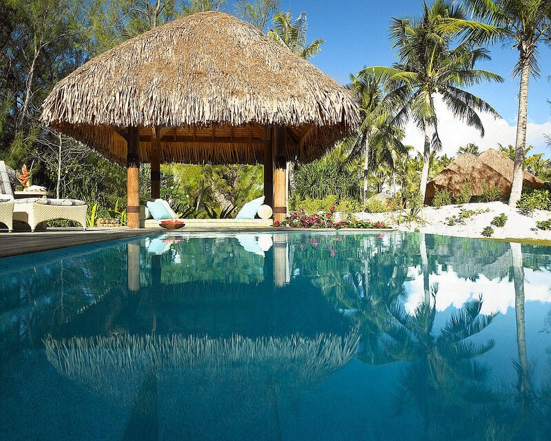 Thatched Hut by Pool — Blue, Serene, Afternoon