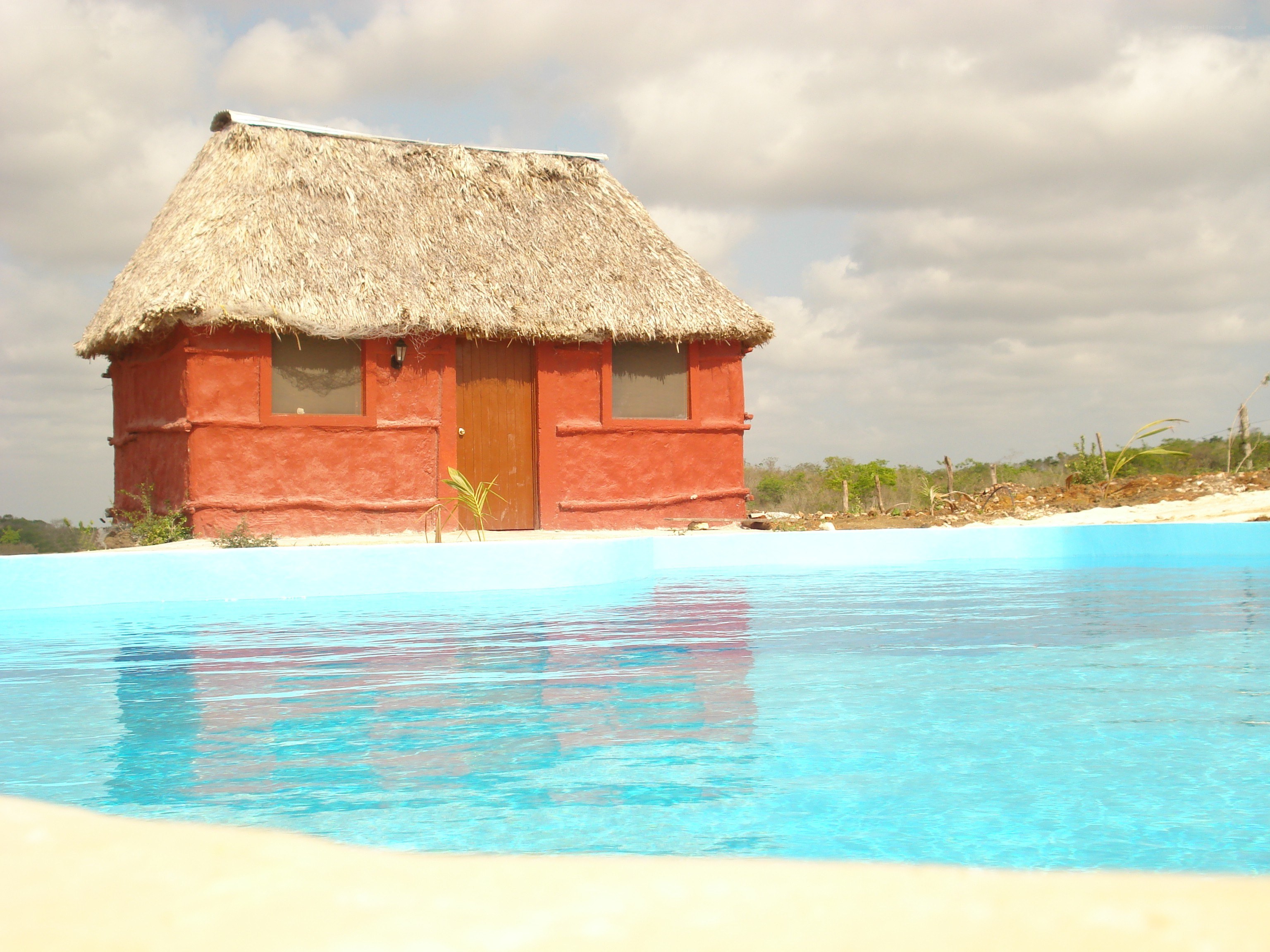 Thatched hut by pool