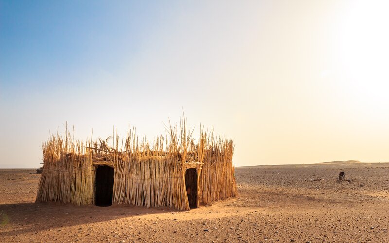 Thatched Hut in Desert