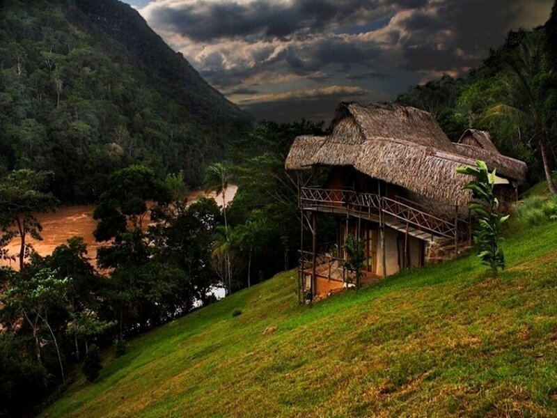 Thatched hut on a jungle hillside