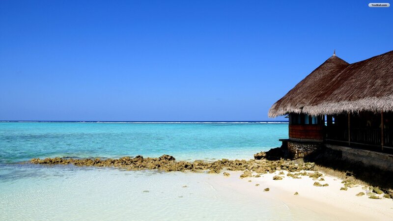 Thatched Hut on Beach — Blue, Serene, Afternoon, Photograph, Ocean, Sand, Rocks