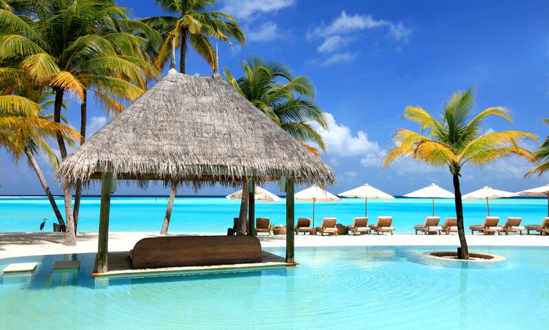 Thatched Hut on Beach — Blue, Serene, Afternoon, Photograph, Palm Trees, Pool