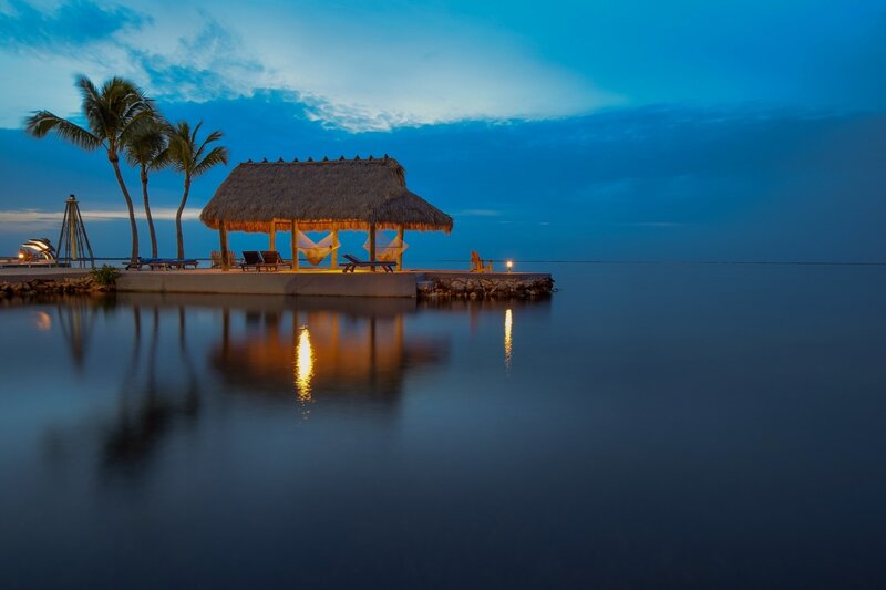Thatched Hut on Pier — Blue, Serene, Night, Photograph