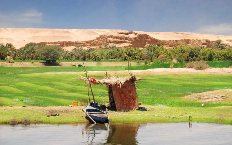 Thatched Hut on Riverbank