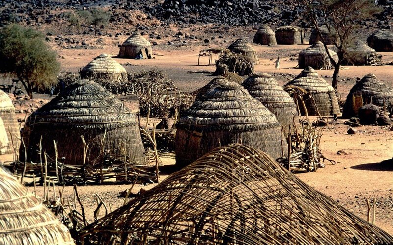 Thatched Huts in Desert
