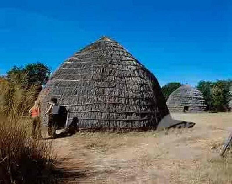 Thatched Huts in Village — Blue