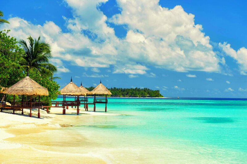 Thatched Huts on Beach — Blue, Serene, Afternoon, Photograph