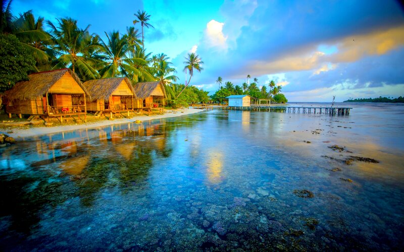 Thatched Huts on Beach — Blue, Serene, Sunset