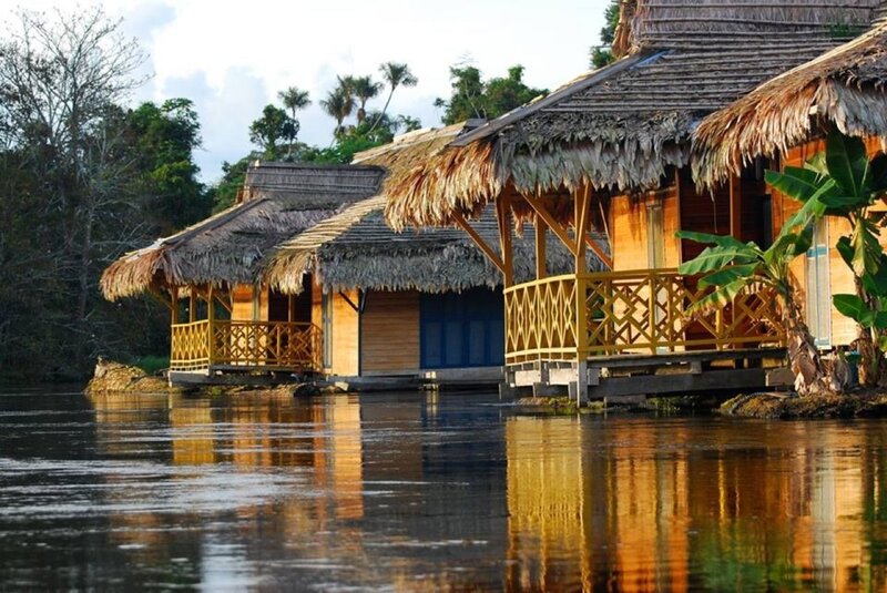 Thatched Huts on Water — Brown