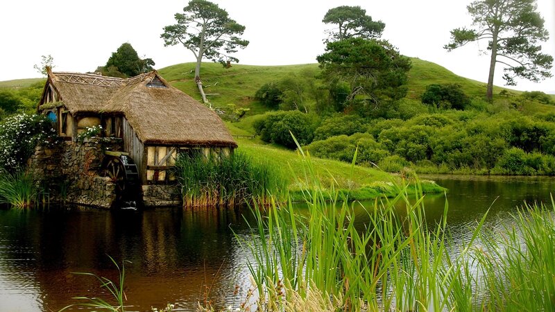 Thatched Mill by River — Green, Serene, Morning