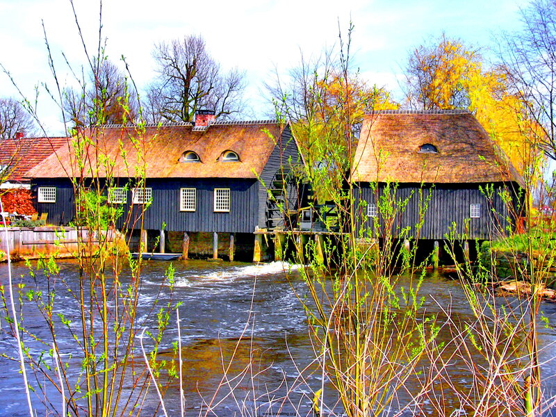Thatched Mill by River