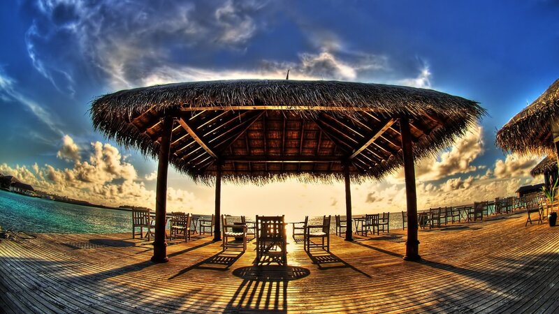 Thatched Pavilion on Deck — Blue, Dramatic, Sunset, Photograph, Ocean, Sky