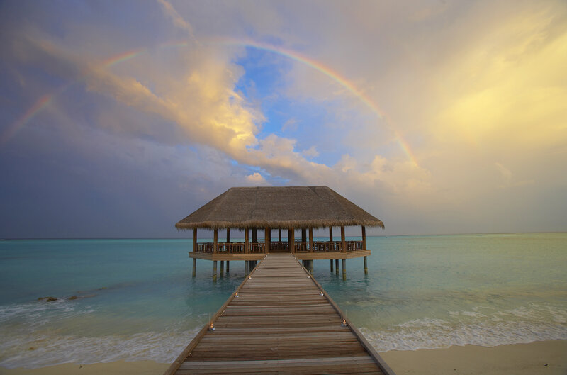 Thatched Pavilion on Pier — Blue, Serene, Sunset