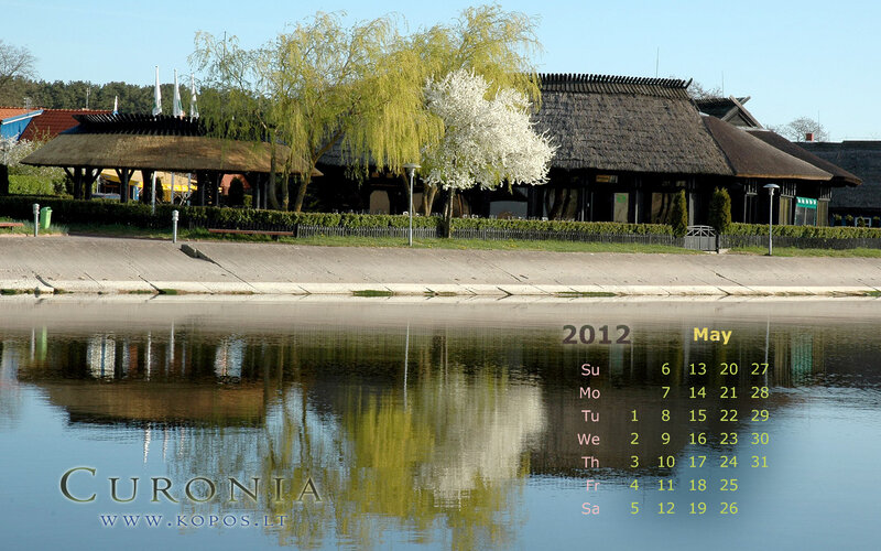 Thatched-roof Buildings by Lake