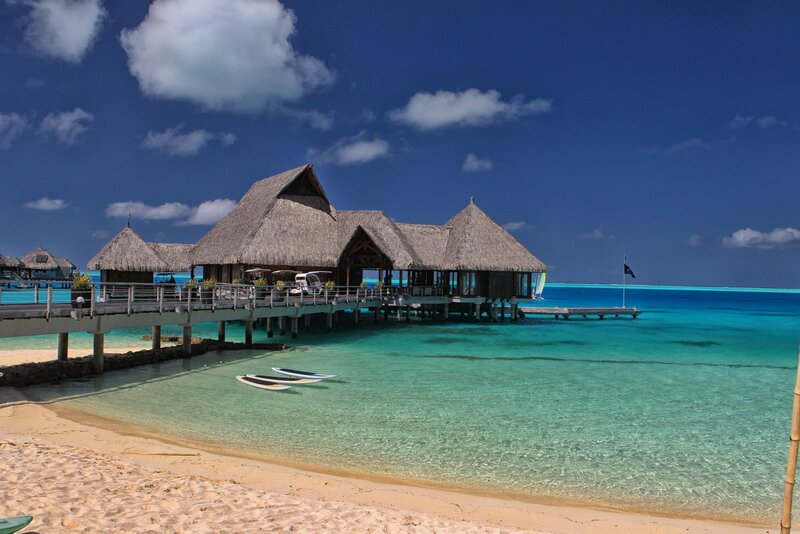 Thatched-roof Bungalows — Blue, Serene