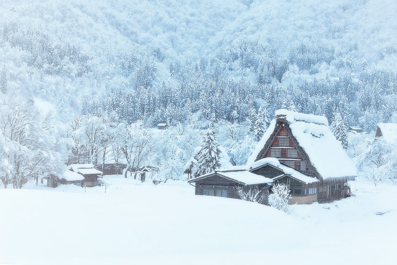 Thatched-roof House in Snow