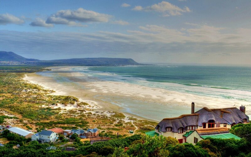 Thatched-roof Houses by Beach