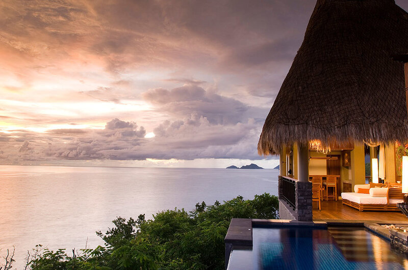 Thatched-roof Villa at Sunset