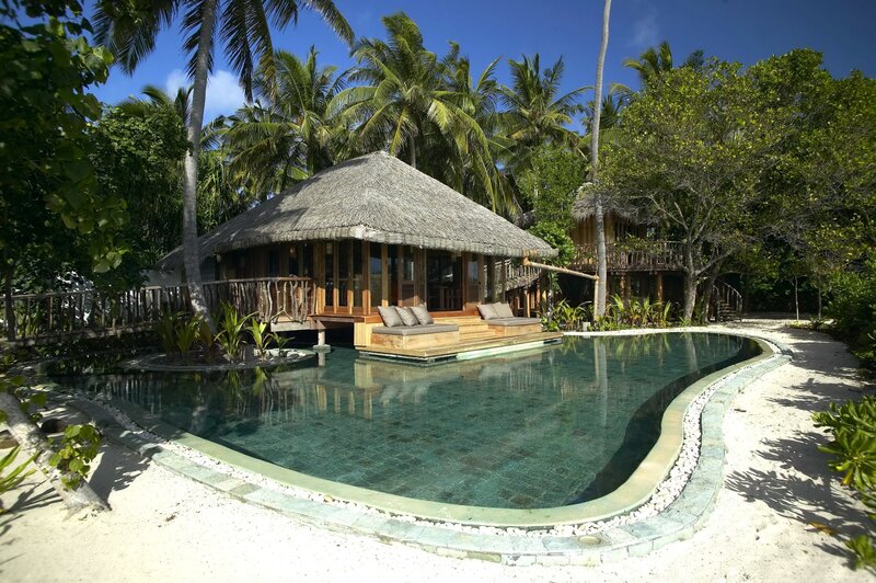 Thatched-roof Villa — Blue, Serene, Afternoon, Photograph
