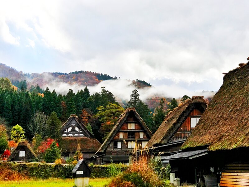 Thatched-roof village in autumn