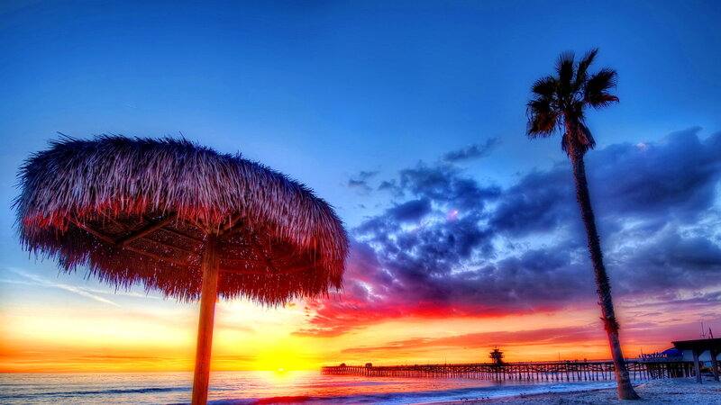 Thatched Umbrella at Sunset