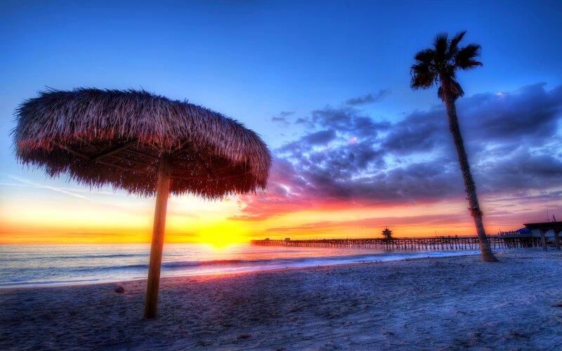 Thatched Umbrella on Beach — Blue, Dramatic, Sunset