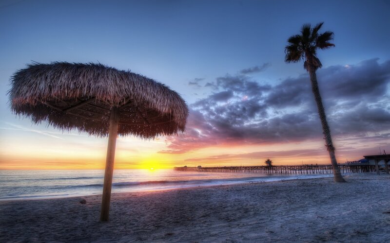Thatched Umbrella on Beach — Blue, Serene, Sunset