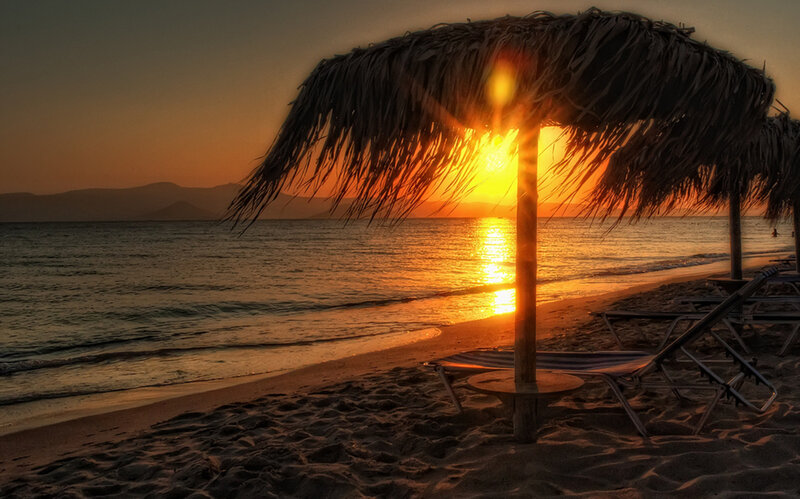 Thatched Umbrella on Beach — Orange, Serene, Sunset