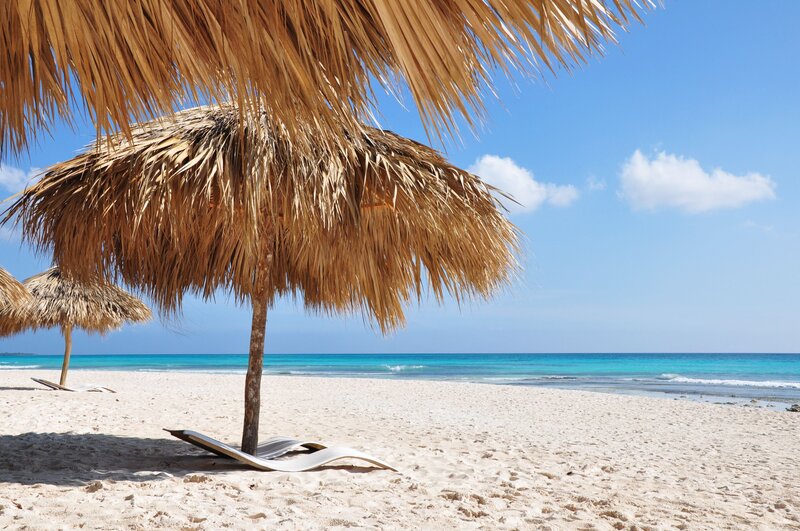 Thatched Umbrellas on Beach — Blue, Serene, Afternoon, Photograph, Umbrella