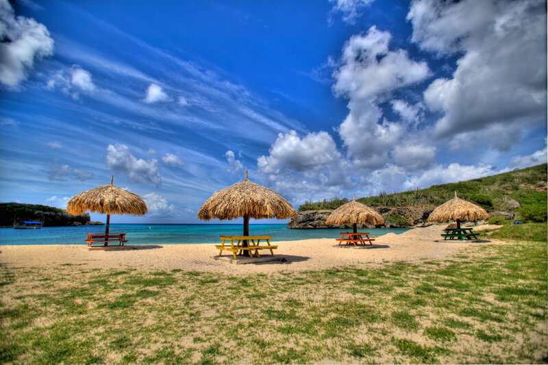 Thatched Umbrellas on Beach — Blue