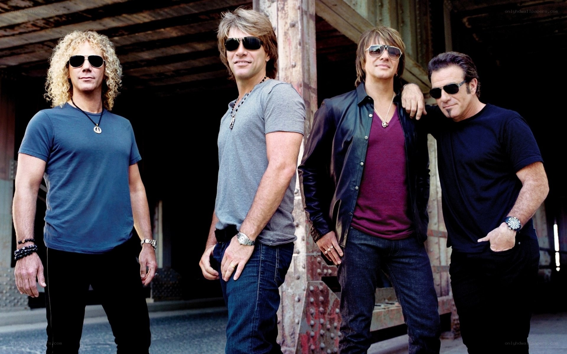 The band Aerosmith poses together