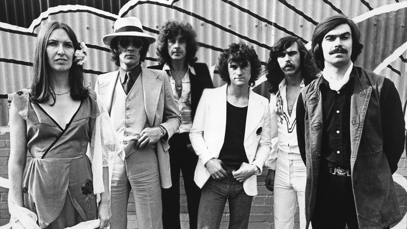 The band in 1970s attire
