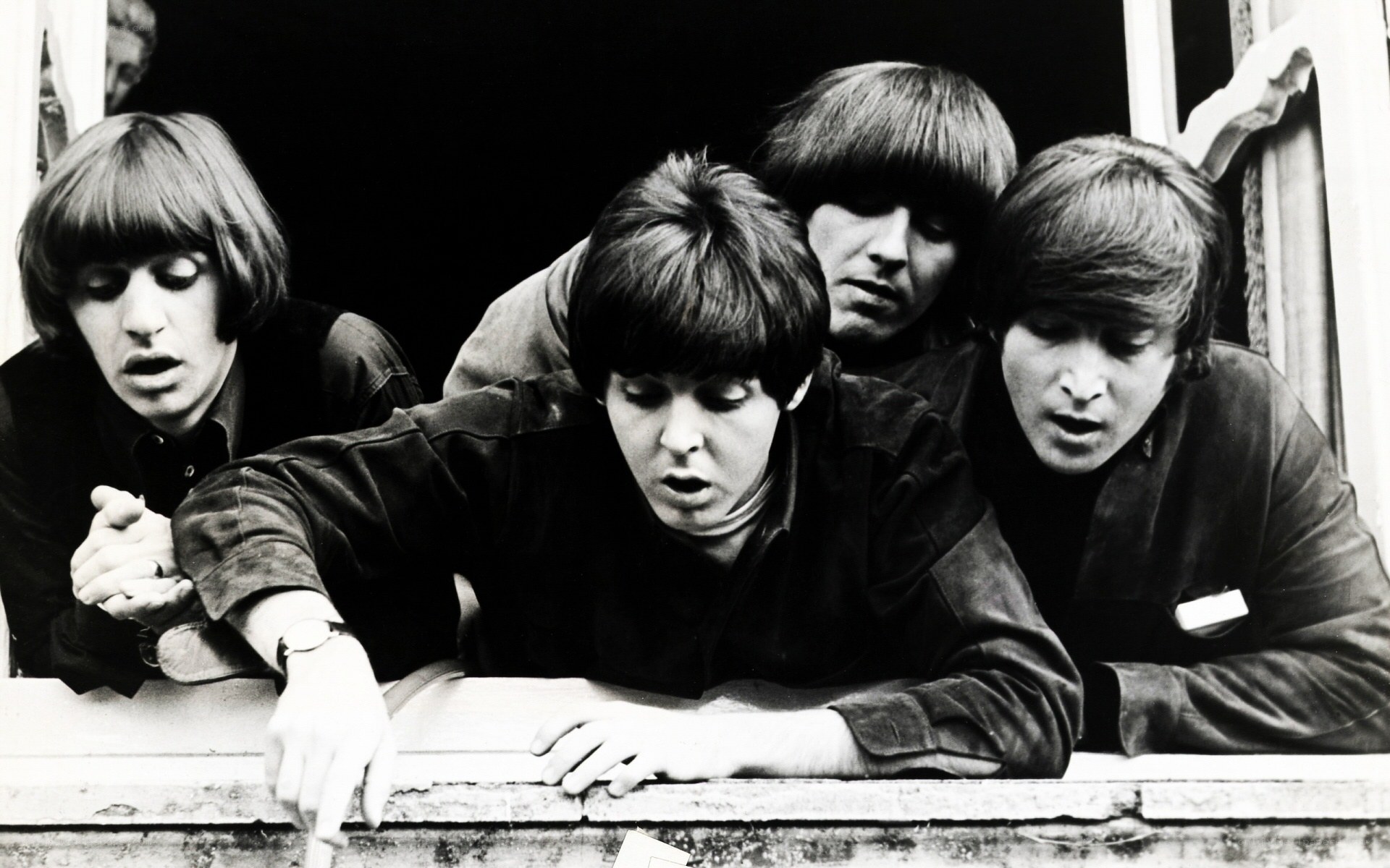 The Beatles at a window